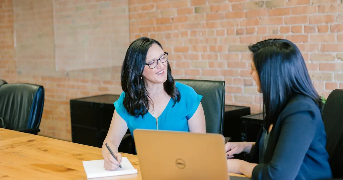 Lawyer meeting a client at a table